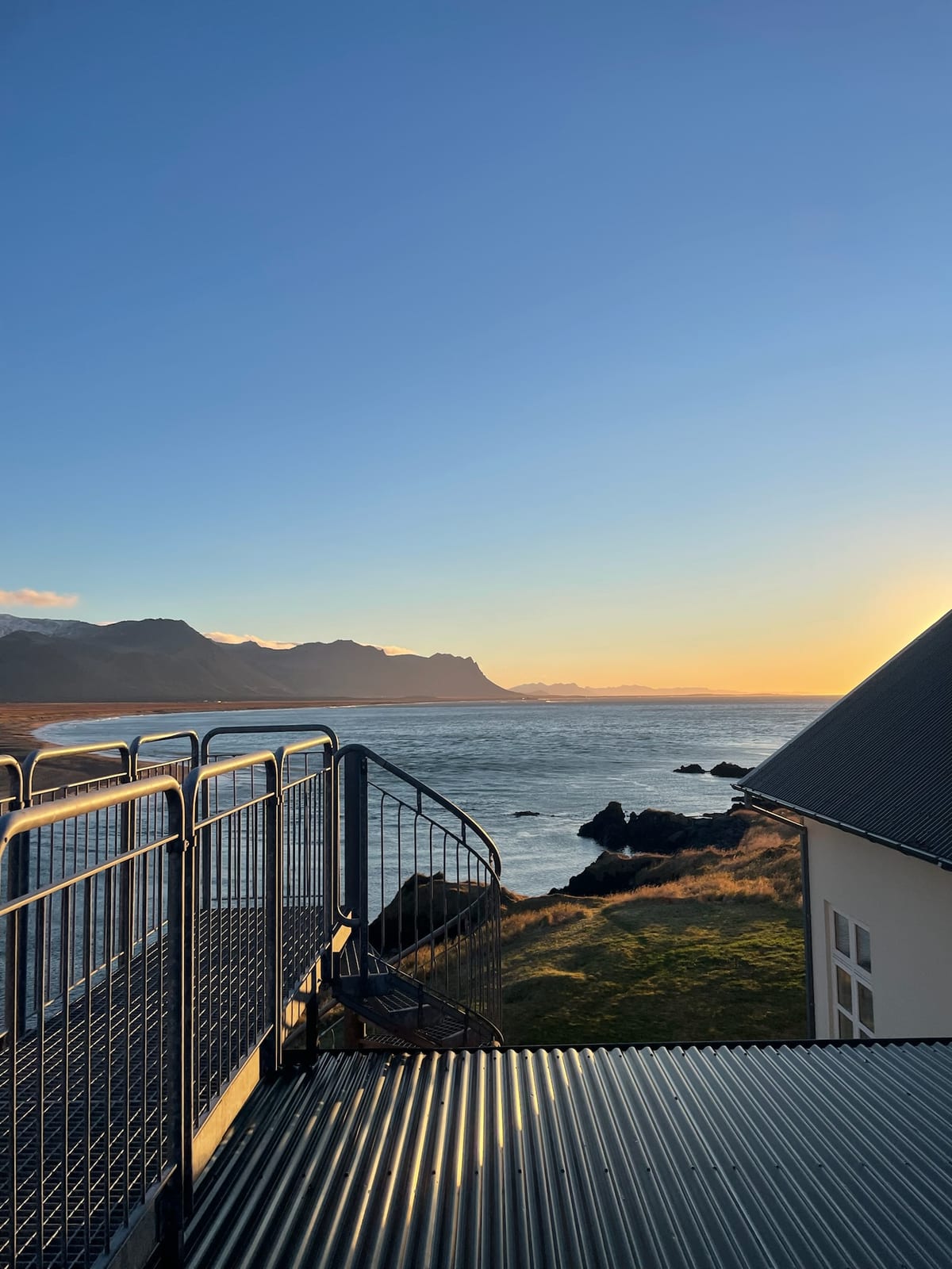 Morning light over the spit and mountains from Hotel Budir