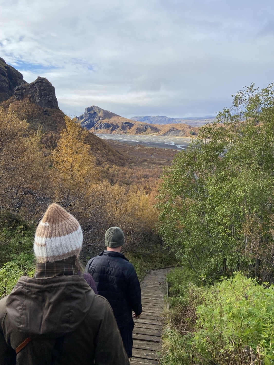 Walking a boardwalk down into the Thorsmork valley in autumn