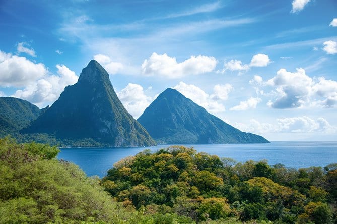 The twin Pitons rising green out of the sea on the southwest coast