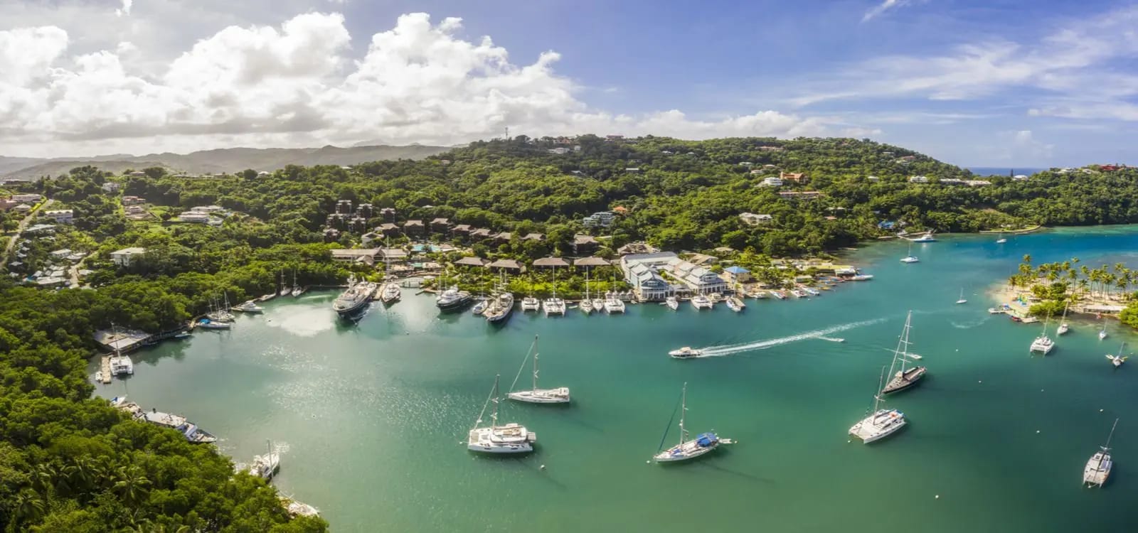 An aerial view of yachts moored in palm-ringed Marigot Bay
