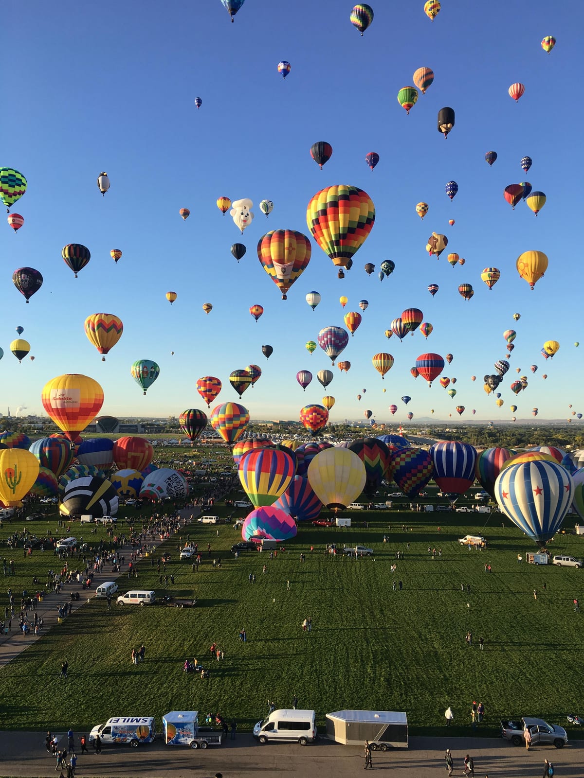 Hundreds of hot air balloons rising over the field at the Albuquerque International Balloon Fiesta