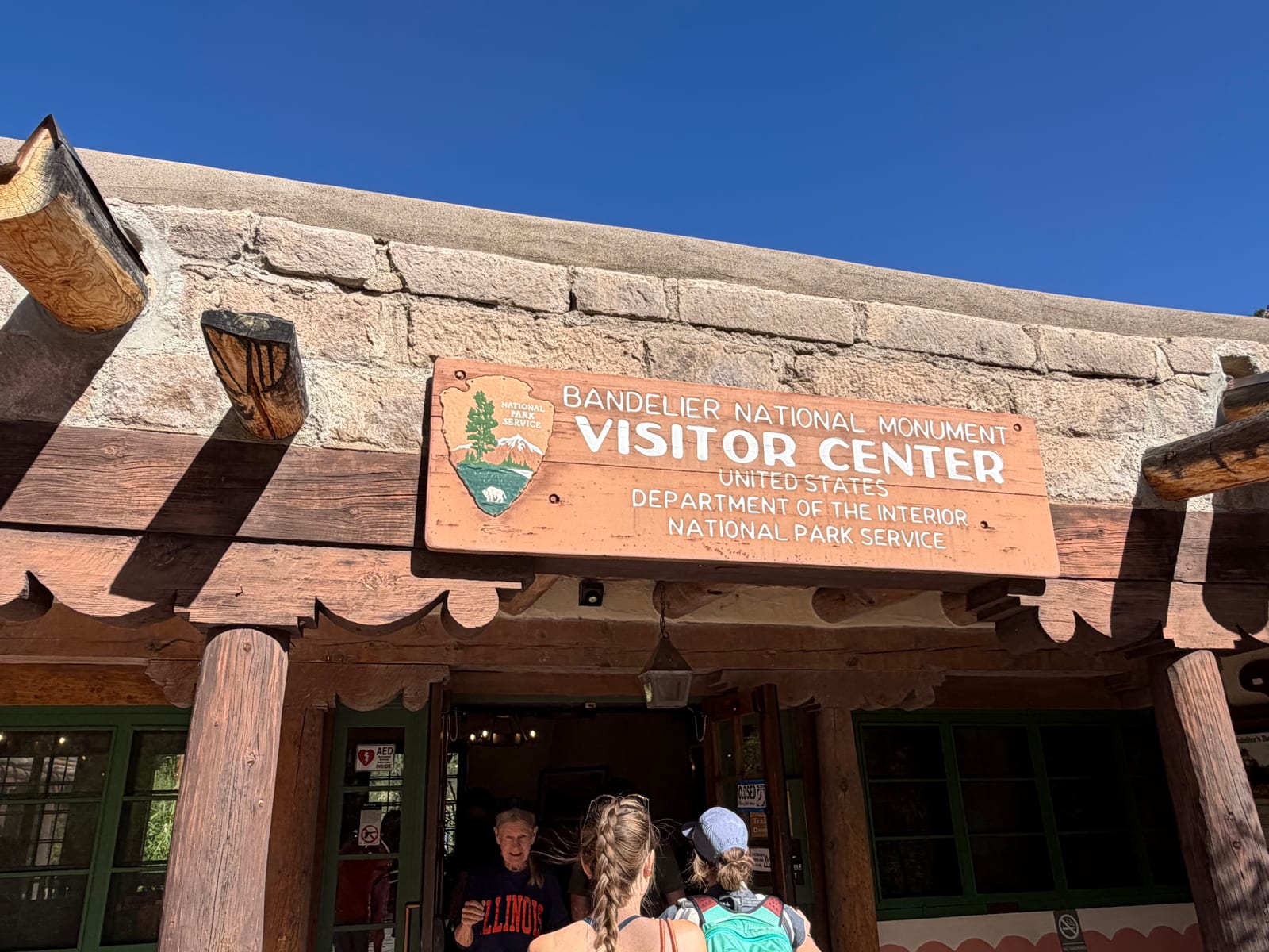 The timber-and-stone Bandelier National Monument visitor center sign